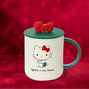 Starbucks Hello Kitty Mug with Red Bow and Green Handle